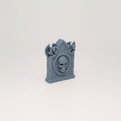 Gargoyle-Flanked Skull Headstone