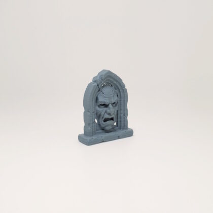 Screaming Face Arch Headstone