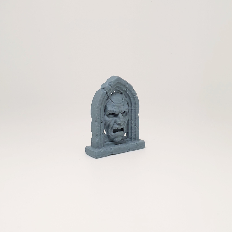 Screaming Face Arch Headstone