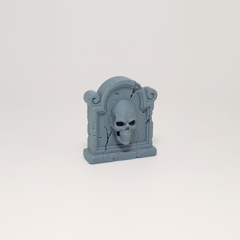 Scroll-Flanked Skull Headstone