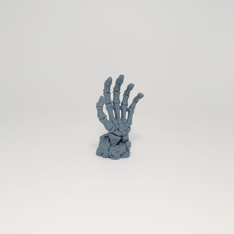 Skeletal Hand Emerging from Earth
